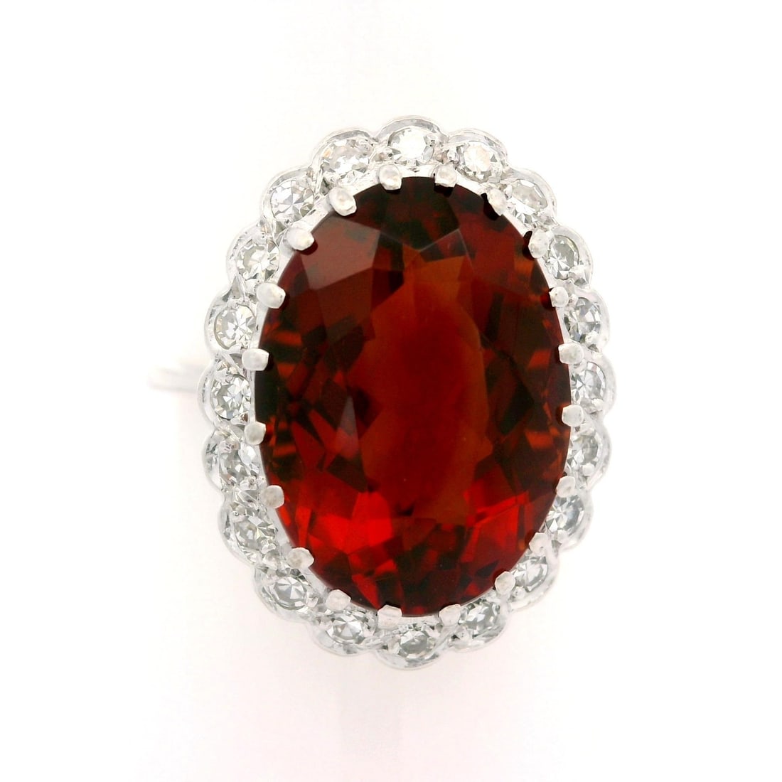 Vintage 18k White Gold Madeira Citrine Diamond Halo Cocktail Ring: Vintage 18k White Gold Madeira Citrine Diamond Halo Cocktail Ring This exquisite vintage cocktail ring features a stunning natural Madeira citrine in an elongated oval cut, measuring approximately 14.