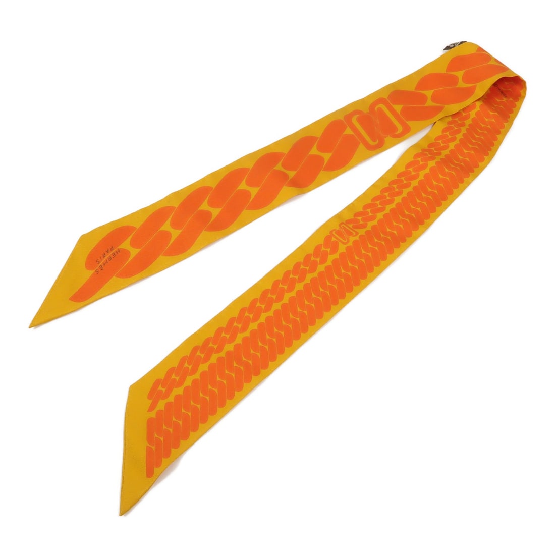 HERMES Twilly Silk Scarf Orange France: HERMES Twilly Silk Scarf Orange France Hermes Twilly scarf in orange silk, designed for women and presented in regular size. Made in France, this scarf measures 86 cm x 5 cm and is offered in very goo
