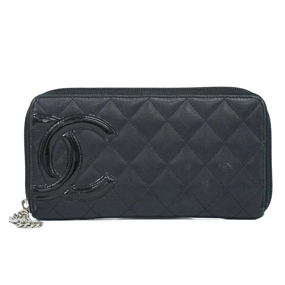 Chanel Cambon Zip Around Wallet Black Leather: Chanel Cambon Zip Around Wallet Black Leather Chanel Cambon Zip Around wallet in black quilted lambskin. This women's leather wallet is made in Spain and remains in good overall condition, showing sig