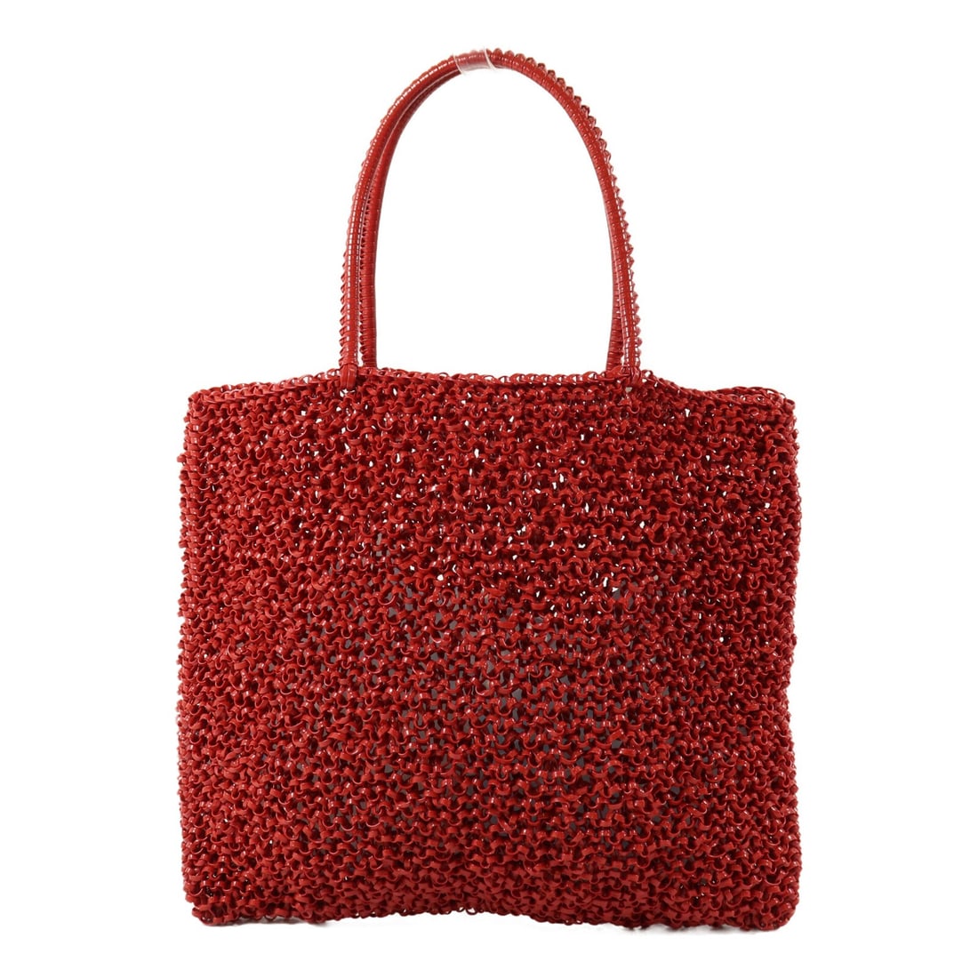 ANTEPRIMA Red PVC Tote Bag SHW: ANTEPRIMA Red PVC Tote Bag SHW A red ANTEPRIMA SHW tote bag made from PVC. It features a slim profile with a 29 cm width, 26 cm height, and 1.5 cm depth, plus a 35 cm handle drop. The bag is described