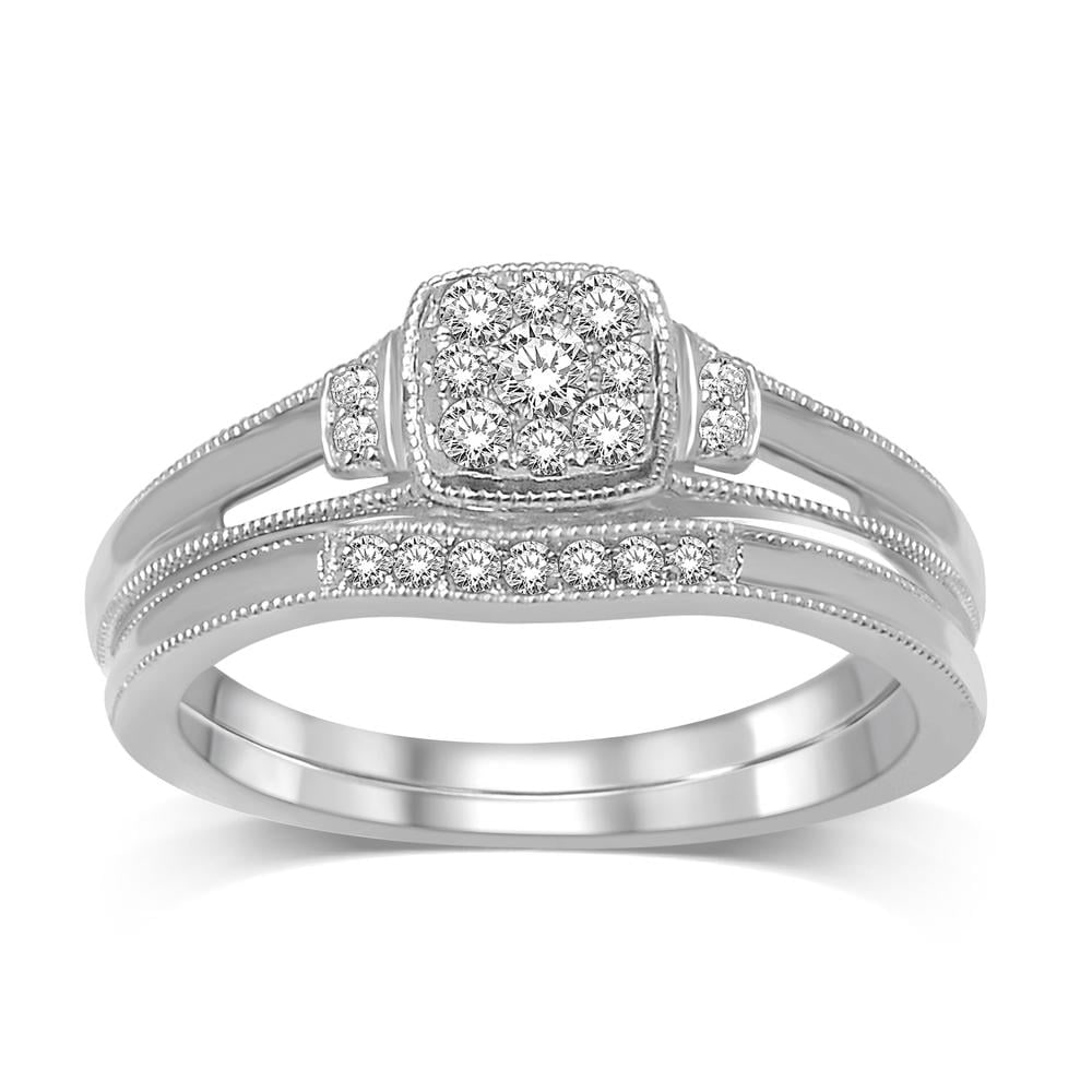 10K White Gold 1/5 Ct.tw Diamond Bridal Ring: 10K White Gold 1/5 Ct.tw Diamond Bridal Ring This glamorous Bridal Ring is available in 10K White Gold. There is 1 round diamond with a total carat weight of 1/5 Ct.Tw. set in a micro prong / shared p