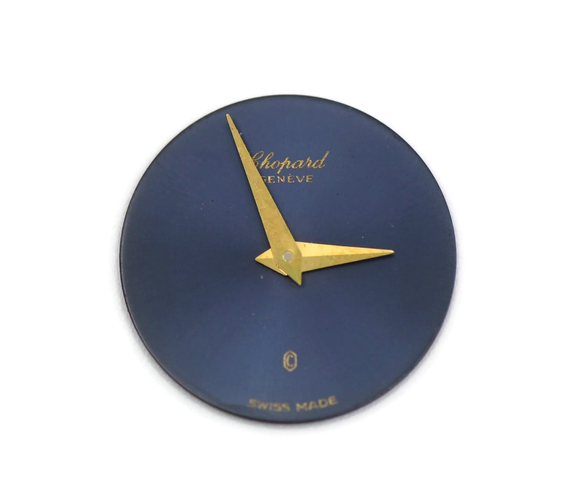 Chopard 16mm Blue Watch Dial: Chopard 16mm Blue Watch Dial This is a pre-owned blue dial designed for Chopard watches. The dial measures 16mm and is compatible with Chopard timepieces. Made in Switzerland, this authentic Chopard c