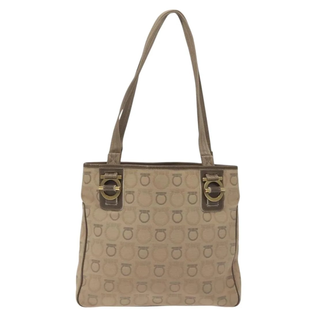 Gancini Canvas Tote Bag by Salvatore Ferragamo in Beige: Gancini Canvas Tote Bag by Salvatore Ferragamo in Beige This Salvatore Ferragamo Gancini Tote for women features beige canvas material with leather details and metal fittings. The tote measures 31cm x