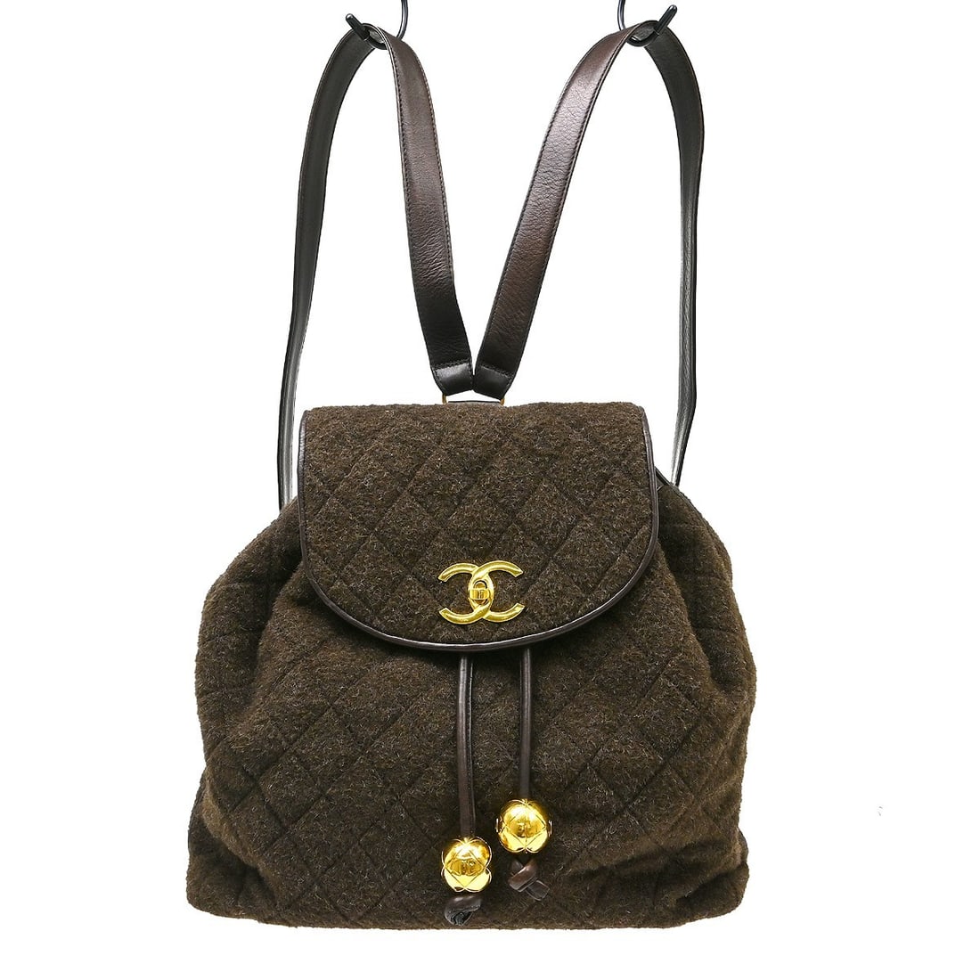 CHANEL Duma Quilted Wool Backpack Brown Medium Italy: CHANEL Duma Quilted Wool Backpack Brown Medium Italy Brown Chanel backpack in wool with a matelasse quilted design, flap turnlock and drawstring closure, leather lining, and chain adjustable straps. T