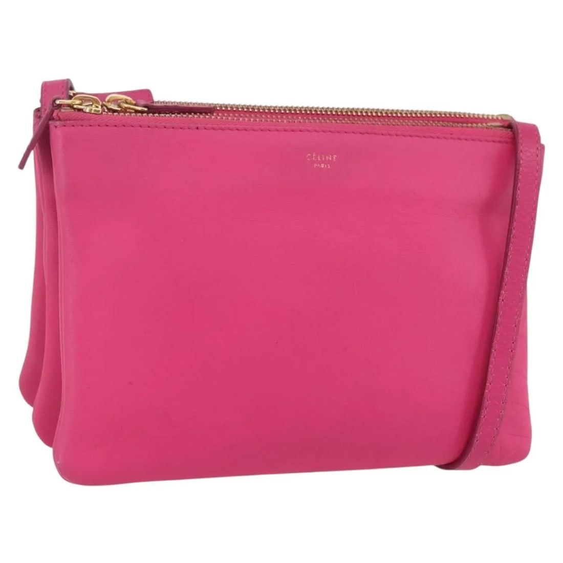 Celine Trio Pink Leather Shoulder Bag: Celine Trio Pink Leather Shoulder Bag This Celine Trio Crossbody Bag features a stylish pink leather exterior and a practical design. The bag shows signs of wear, including surface rubbing, slight los
