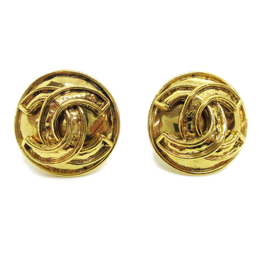 Chanel 94P Gold Tone CC Logo Button Clip Earrings: Chanel 94P Gold Tone CC Logo Button Clip Earrings Chanel CC logo button earrings in a gold-tone finish with clip-on backs. Made in France, this pair features the classic button shape and 94P marking. 
