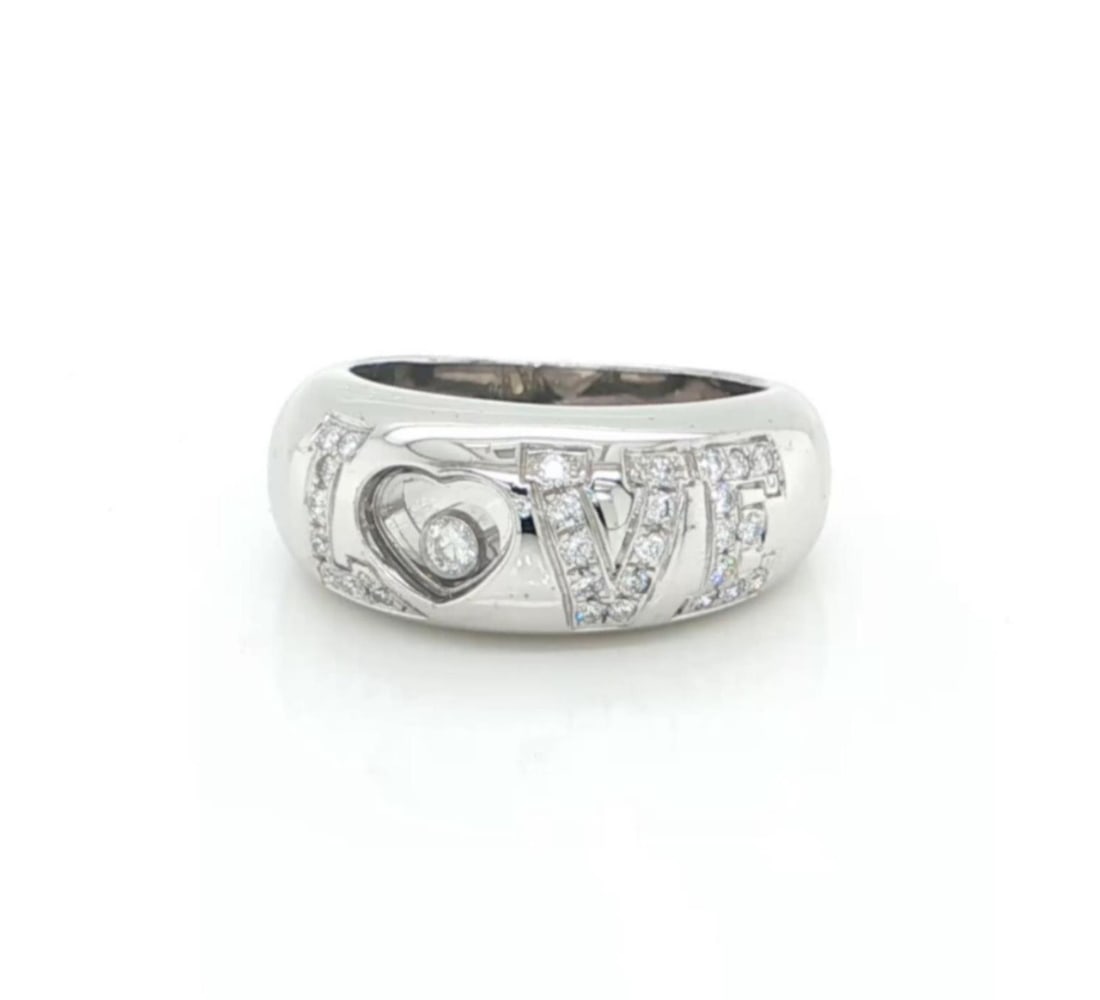 Chopard Happy Diamonds LOVE 18k White Gold Ring Size 4 with Certificate: Chopard Happy Diamonds LOVE 18k White Gold Ring Size 4 with Certificate A pre-owned Chopard Happy Diamonds LOVE floating diamond ring crafted in 18k white gold. The sculptural dome design features the