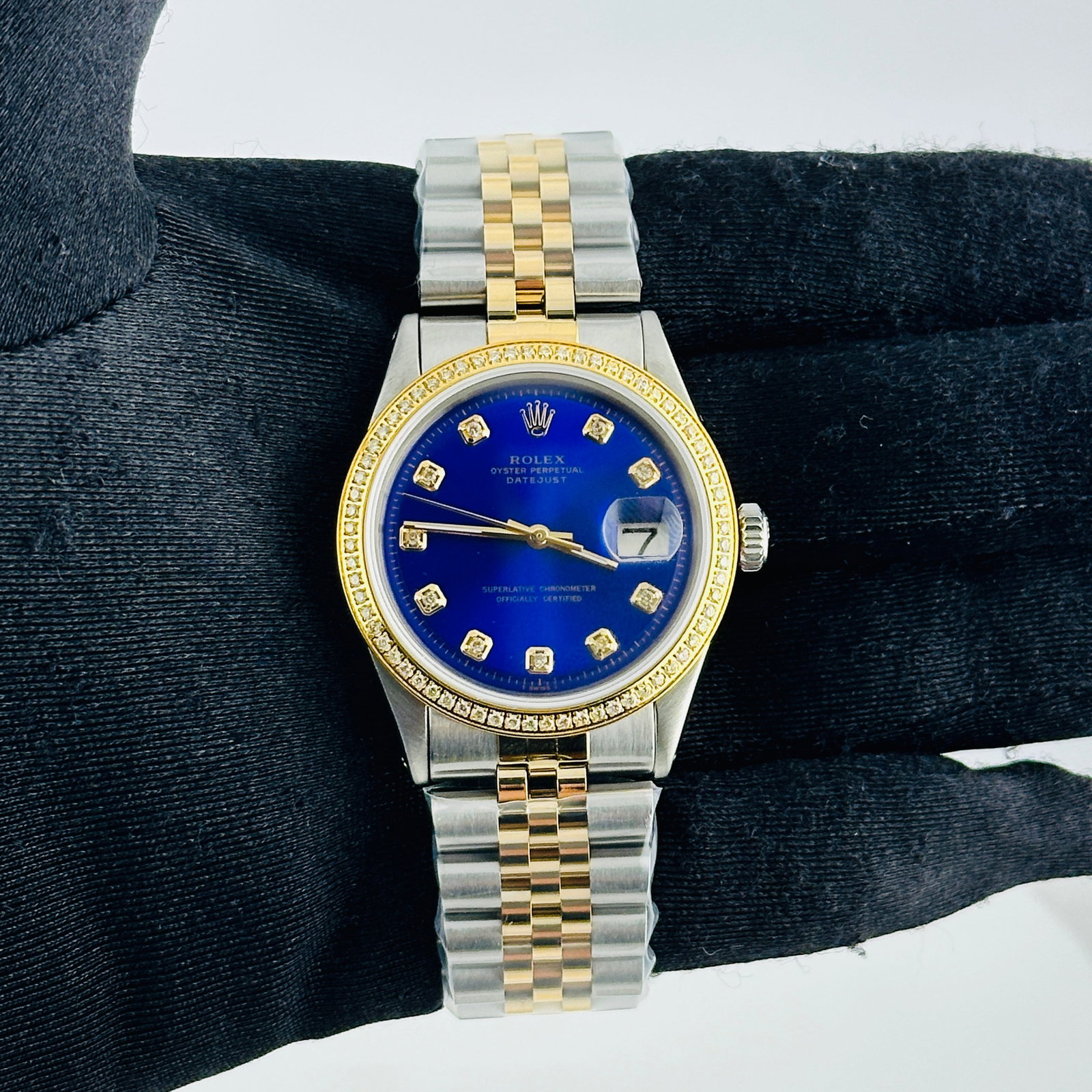 Rolex Datejust Ref. 1601-3 Mens Watch Aftermarket Jubilee Bracelet: Rolex Datejust Ref. 1601-3 Mens Watch Aftermarket Jubilee Bracelet Mens Rolex Datejust with an Aftermarket dark blue dial featuring yellow diamond markers. It has a pave yellow gold plated diamond bez