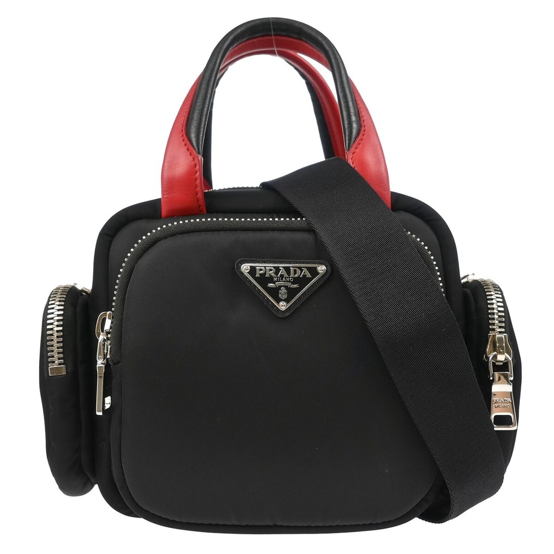 Prada 1BB061 black nylon top handle bag with shoulder strap: Prada 1BB061 black nylon top handle bag with shoulder strap Prada black nylon 2-way tote handbag with top handles and a removable shoulder strap for hand or shoulder carry. The bag features a black ny