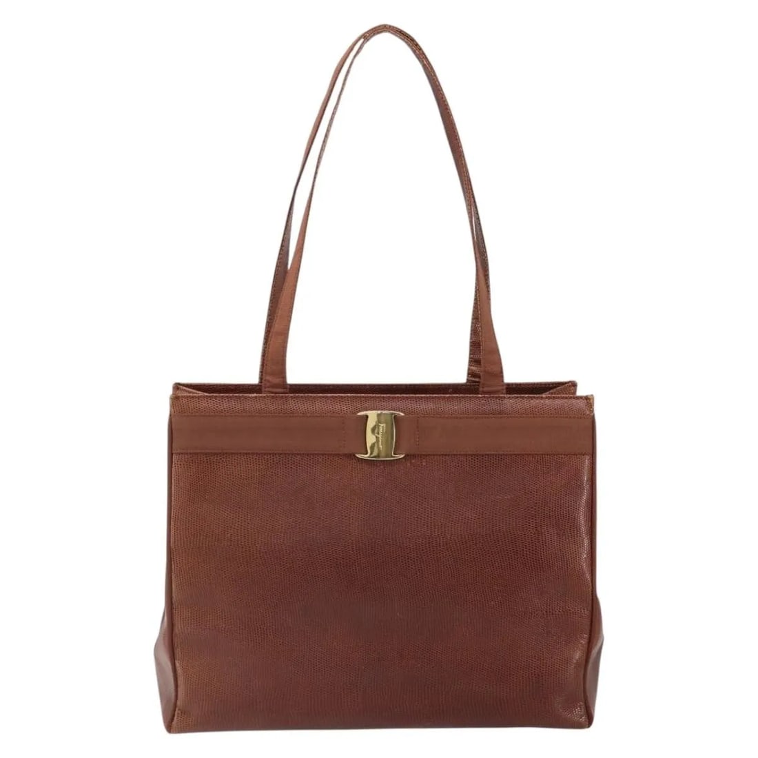 Vala Tote Bag in Brown Leather by Salvatore Ferragamo: Vala Tote Bag in Brown Leather by Salvatore Ferragamo This Salvatore Ferragamo Vala tote is crafted from brown leather and designed for women. Made in Italy, it features spacious proportions and a cla