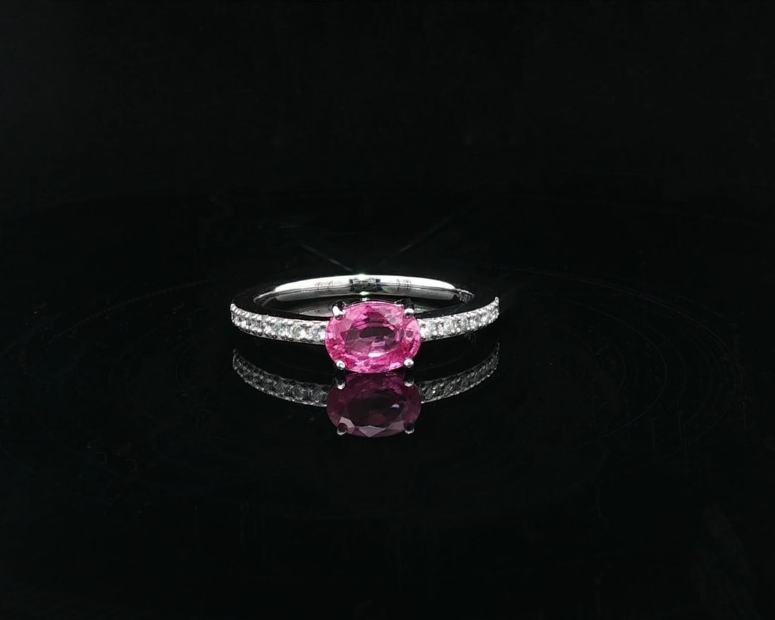 Platinum GIA Certified Vivid Pink Oval Sapphire Diamond Stackable Ring: Platinum GIA Certified Vivid Pink Oval Sapphire Diamond Stackable Ring This exquisite dainty stackable ring features a vivid oval pink sapphire, certified by GIA, set in solid .950 platinum. The ring 