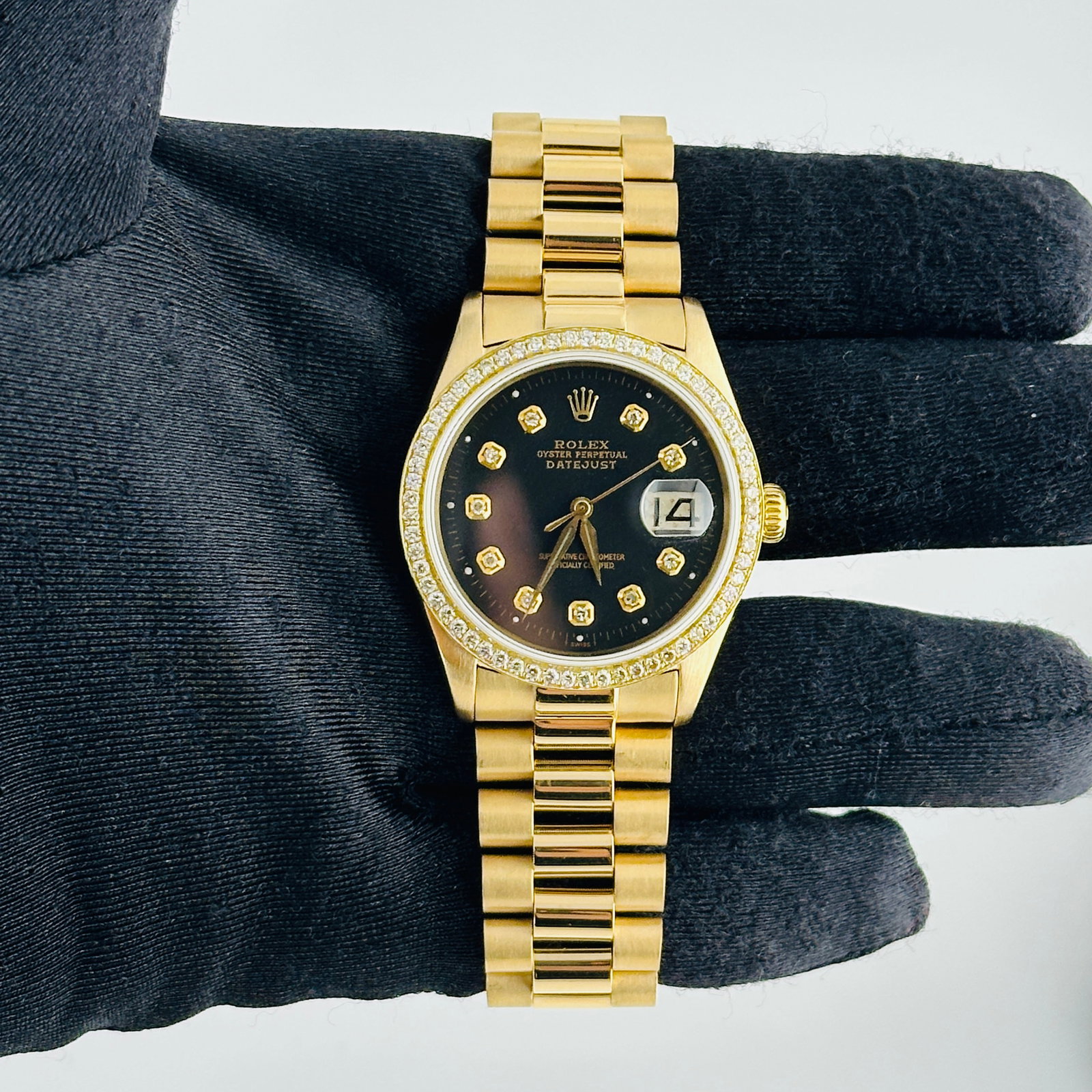 Rolex Datejust 18K Presi Bracelet Black Dial Ref 6605: Rolex Datejust 18K Presi Bracelet Black Dial Ref 6605 This men's Rolex Datejust features an aftermarket black dial with yellow diamond markers, complemented by an aftermarket President-style 18K brace
