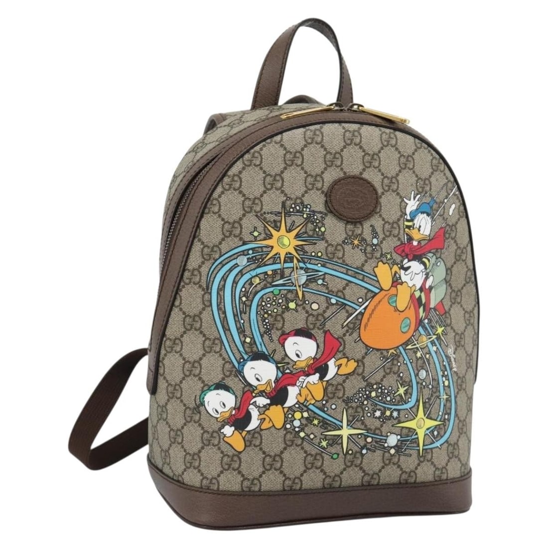 Disney x Gucci GG Supreme PVC Leather Backpack Beige 552884: Disney x Gucci GG Supreme PVC Leather Backpack Beige 552884 A Gucci x Disney GG Supreme backpack in beige, made from PVC leather and GG canvas. It comes with a dust bag and was made in Italy. The bag 