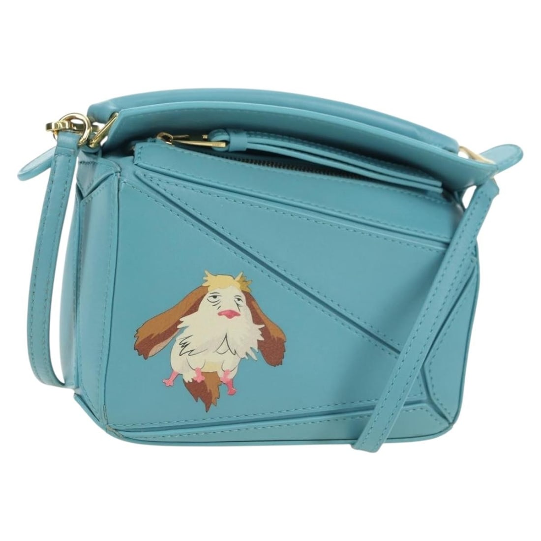 LOEWE Ghibli Howls Mini Puzzle 2way Leather Hand Bag Light Blue: LOEWE Ghibli Howls Mini Puzzle 2way Leather Hand Bag Light Blue A LOEWE x Ghibli Howl's Puzzle Bag Mini in light blue and gold leather. This 2-way handbag is made in Spain and comes with a shoulder st