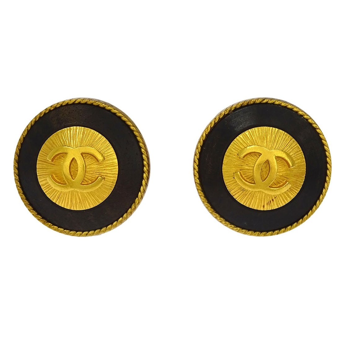 Chanel 94P round clip on logo earrings gold plated: Chanel 94P round clip on logo earrings gold plated Chanel clip-on earrings featuring a round logo design in gold and black. Made in France, this pair is gold plated and marked 94P. Condition is very g