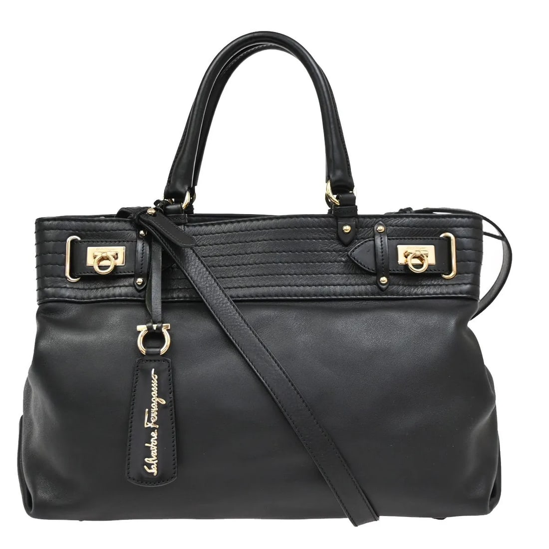Black Leather Gancini Tote Bag by Salvatore Ferragamo: Black Leather Gancini Tote Bag by Salvatore Ferragamo This Salvatore Ferragamo Gancini Tote is crafted from black leather and designed for women. The bag is pre-owned and remains in very good conditio