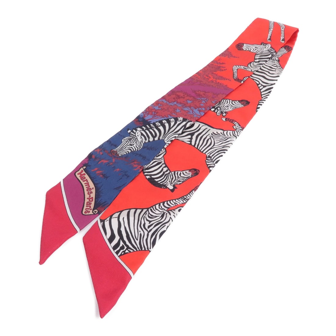 Hermes Twilly silk scarf red multicolor with box: Hermes Twilly silk scarf red multicolor with box Hermes Twilly silk scarf in red and multicolor, offered with a storage box. The item is in very good AB condition and measures 86 cm x 5 cm (33.9 in x 