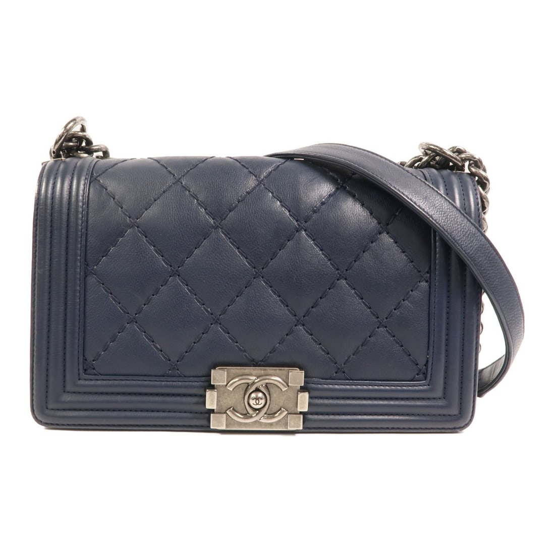 CHANEL Boy 25 Shoulder Bag Navy Calfskin Leather SHW: CHANEL Boy 25 Shoulder Bag Navy Calfskin Leather SHW This CHANEL Boy 25 shoulder bag is crafted from calfskin (cowhide) leather in a blue and navy color combination. It features a flap closure, one op