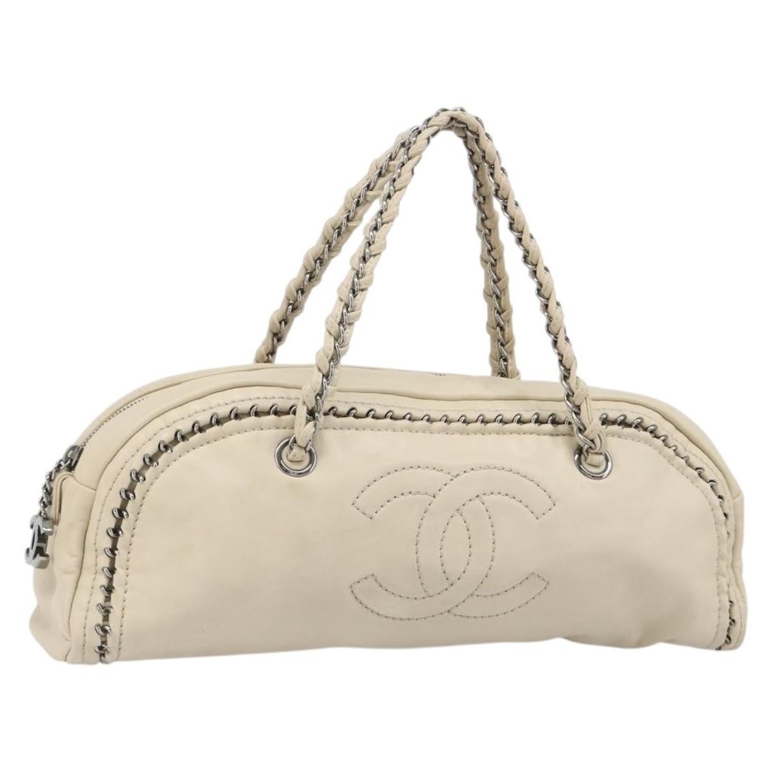 CHANEL Leather Hand Bag in Cream and Silver Made in Italy: CHANEL Leather Hand Bag in Cream and Silver Made in Italy Chanel luxury line handbag in leather with a cream and silver color combination. Made in Italy, this women's handbag features a handle drop of