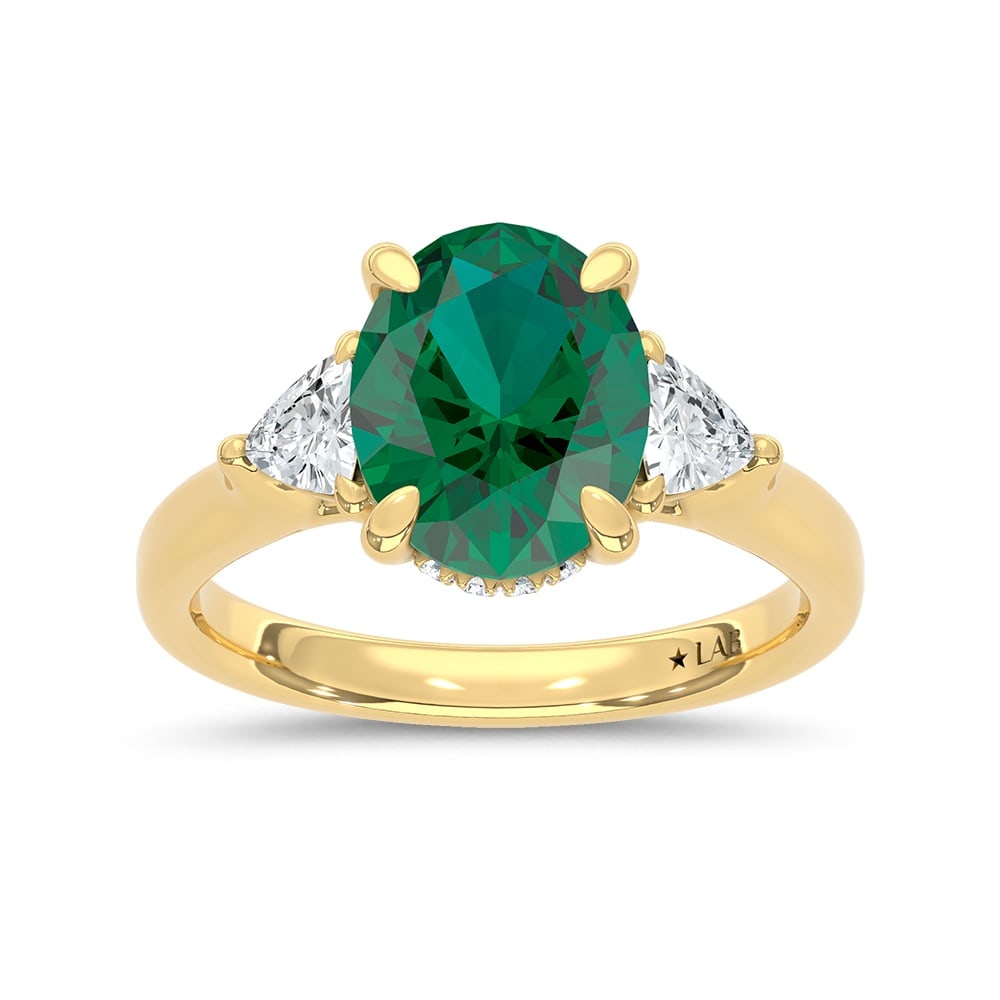 14K Yellow Gold Lab Grown Diamond 3 1/3 Ct.Tw. Oval Shape Recrystalized Emerald Engagement Ring: 14K Yellow Gold Lab Grown Diamond 3 1/3 Ct.Tw. Oval Shape Recrystalized Emerald Engagement Ring (Center 2 3/4 ct) Celebrate refined elegance with this 14K yellow gold engagement ring. Its centerpiece 