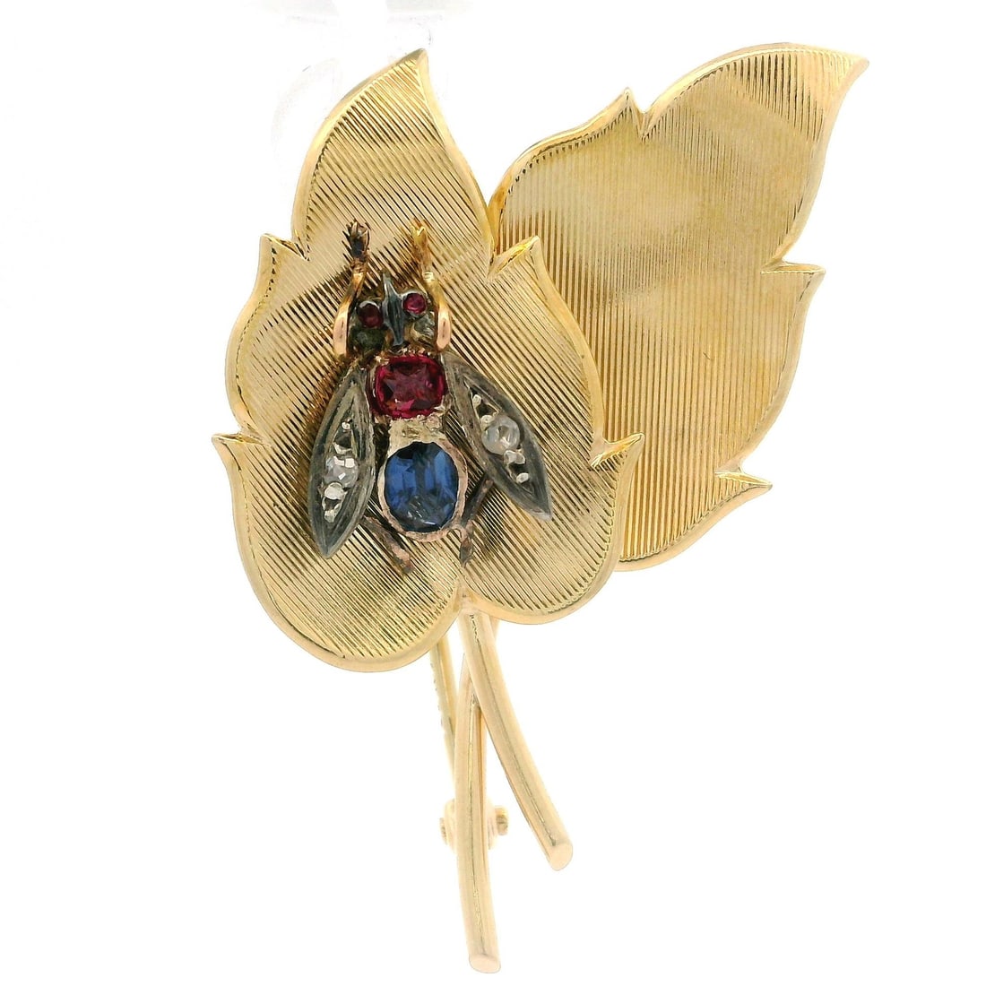 Vintage 14k Gold Silver Spinel Sapphire Diamond Fly Leaf Brooch: Vintage 14k Gold Silver Spinel Sapphire Diamond Fly Leaf Brooch This exquisite vintage brooch features a charming design of a fly resting on a leaf, adorned with beautiful gemstones. The piece is craf