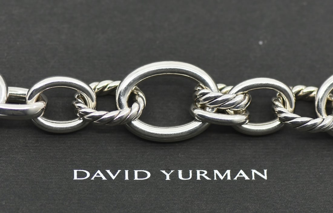 Sterling Silver Oval Link Necklace with Diamonds by David Yurman: Sterling Silver Oval Link Necklace with Diamonds by David Yurman This pre-owned David Yurman necklace features an oval link chain design crafted in 925 sterling silver. The necklace is accented with d