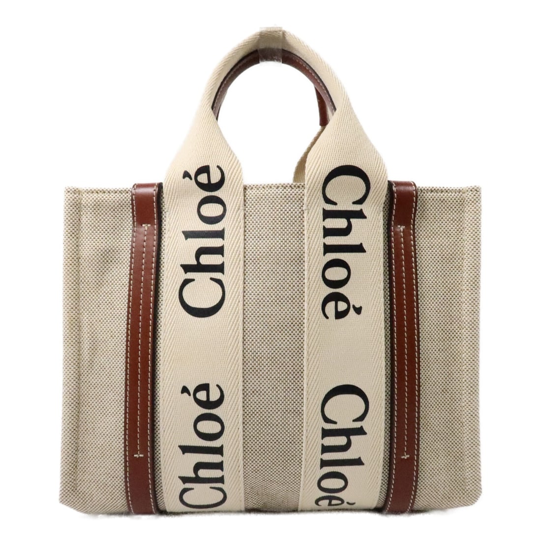 Chloe Woody Mini Canvas Handbag Brown with Shoulder Strap: Chloe Woody Mini Canvas Handbag Brown with Shoulder Strap Chloe Mini Woody Hand Bag in brown canvas, offered in very good AB condition. It features one open outside pocket and comes with a storage bag
