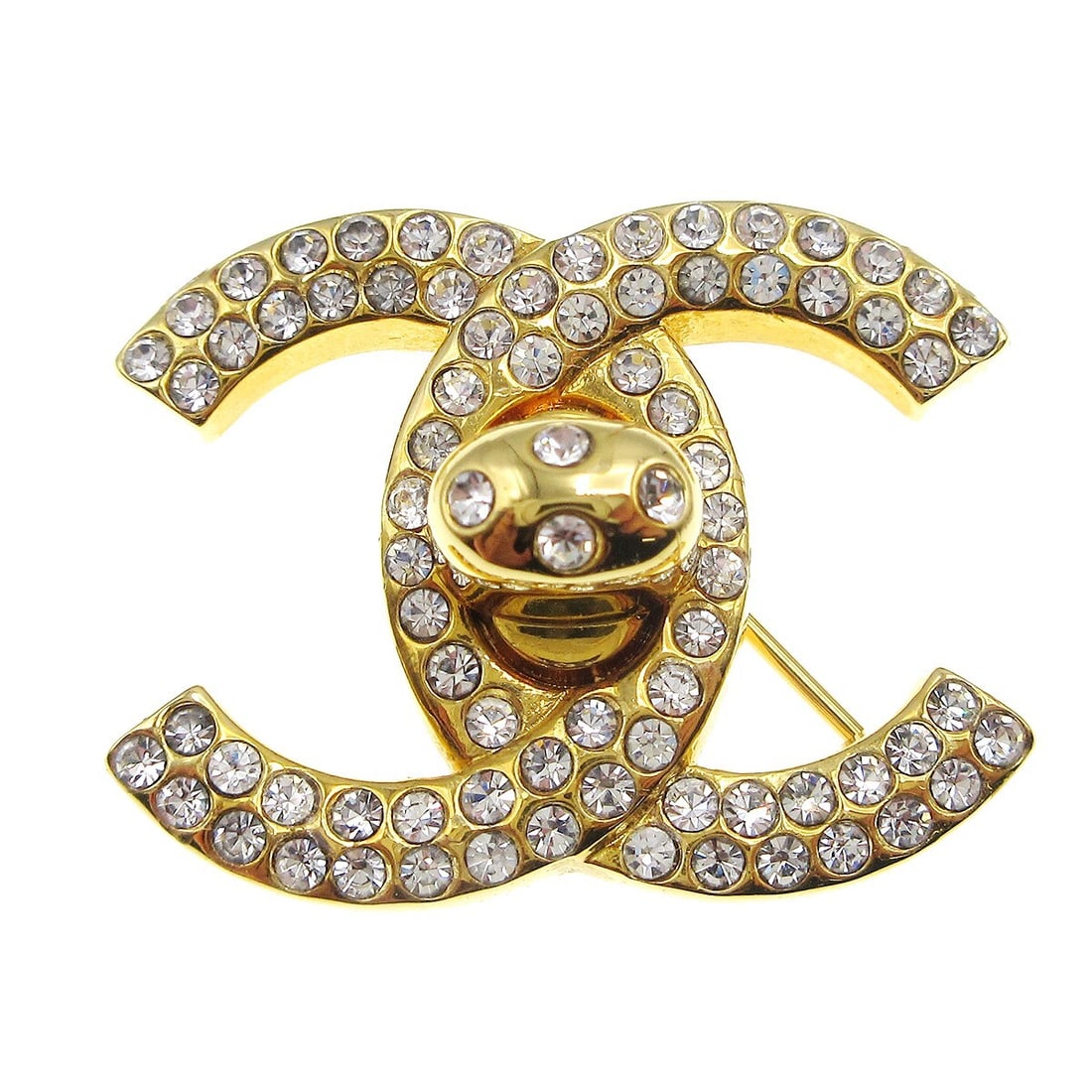 Chanel CC Turnlock Rhinestone Brooch Gold Plated 97P: Chanel CC Turnlock Rhinestone Brooch Gold Plated 97P Small Chanel CC turnlock brooch pin with rhinestone accents and a gold-plated finish. Made in France, this brooch features the iconic double C logo
