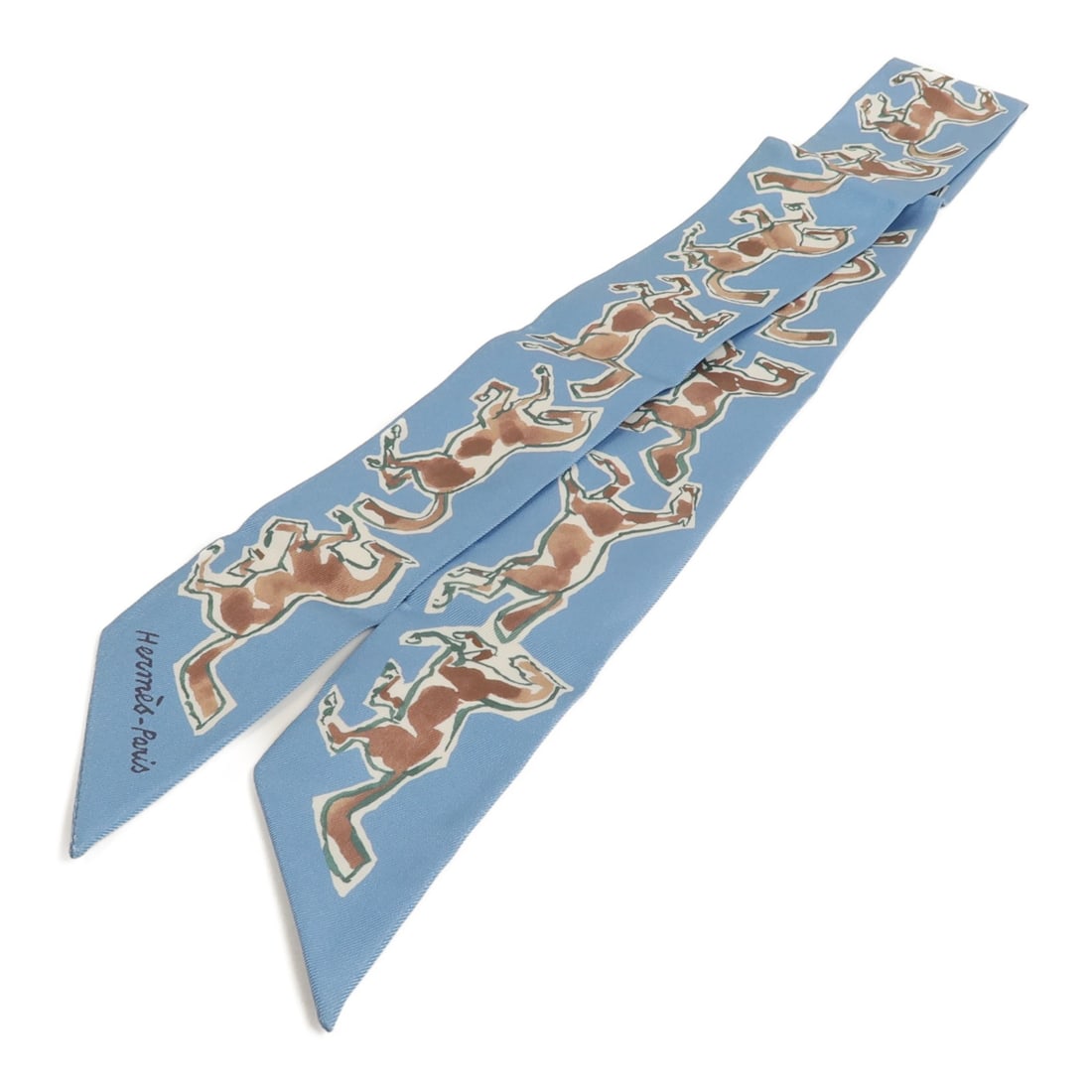 Hermes Twilly Silk Scarf Blue Brown Made in France: Hermes Twilly Silk Scarf Blue Brown Made in France A Hermes Twilly scarf in silk with a blue and brown colorway. It is a women's regular-size scarf made in France and is offered in very good AB condit