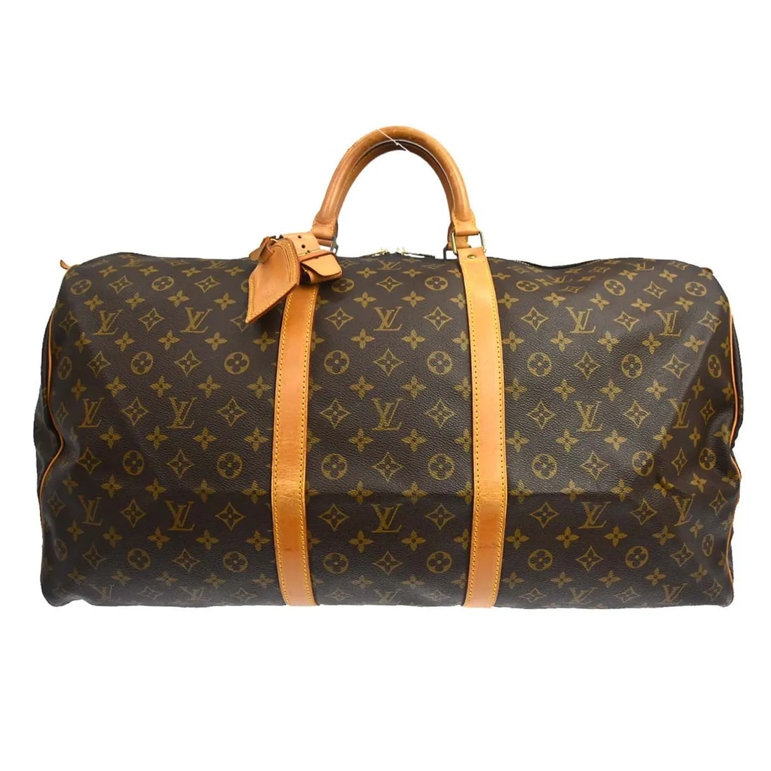 Louis Vuitton Keepall travel bag in monogram canvas: Louis Vuitton Keepall travel bag in monogram canvas Louis Vuitton Keepall in brown monogram canvas. This unisex travel bag is in good condition with visible wear throughout. The exterior leather shows