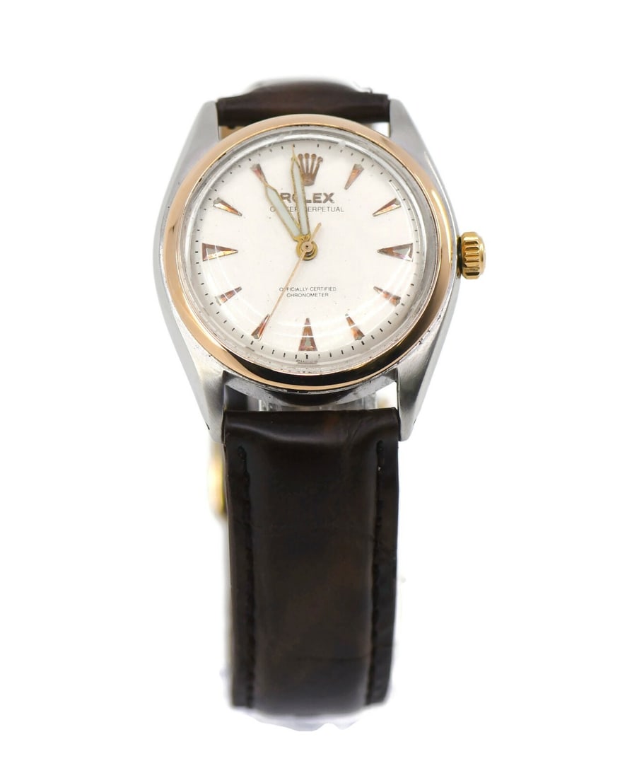 Rolex Oyster Perpetual 6084 Two Tone Stainless Steel Watch: Rolex Oyster Perpetual 6084 Two Tone Stainless Steel Watch Introducing the exquisite Rolex Oyster Perpetual Two Tone Stainless Steel Watch, model reference 6084. This elegant wristwatch features a mec