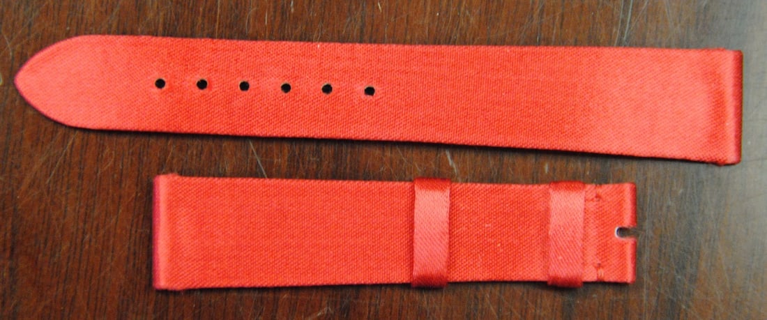 Chopard Authentic Red Fabric Wristwatch Band 16x14mm: Chopard Authentic Red Fabric Wristwatch Band 16x14mm This Chopard Factory Original wristwatch band features a vibrant red fabric/canvas construction, designed for durability and style. With a band wid