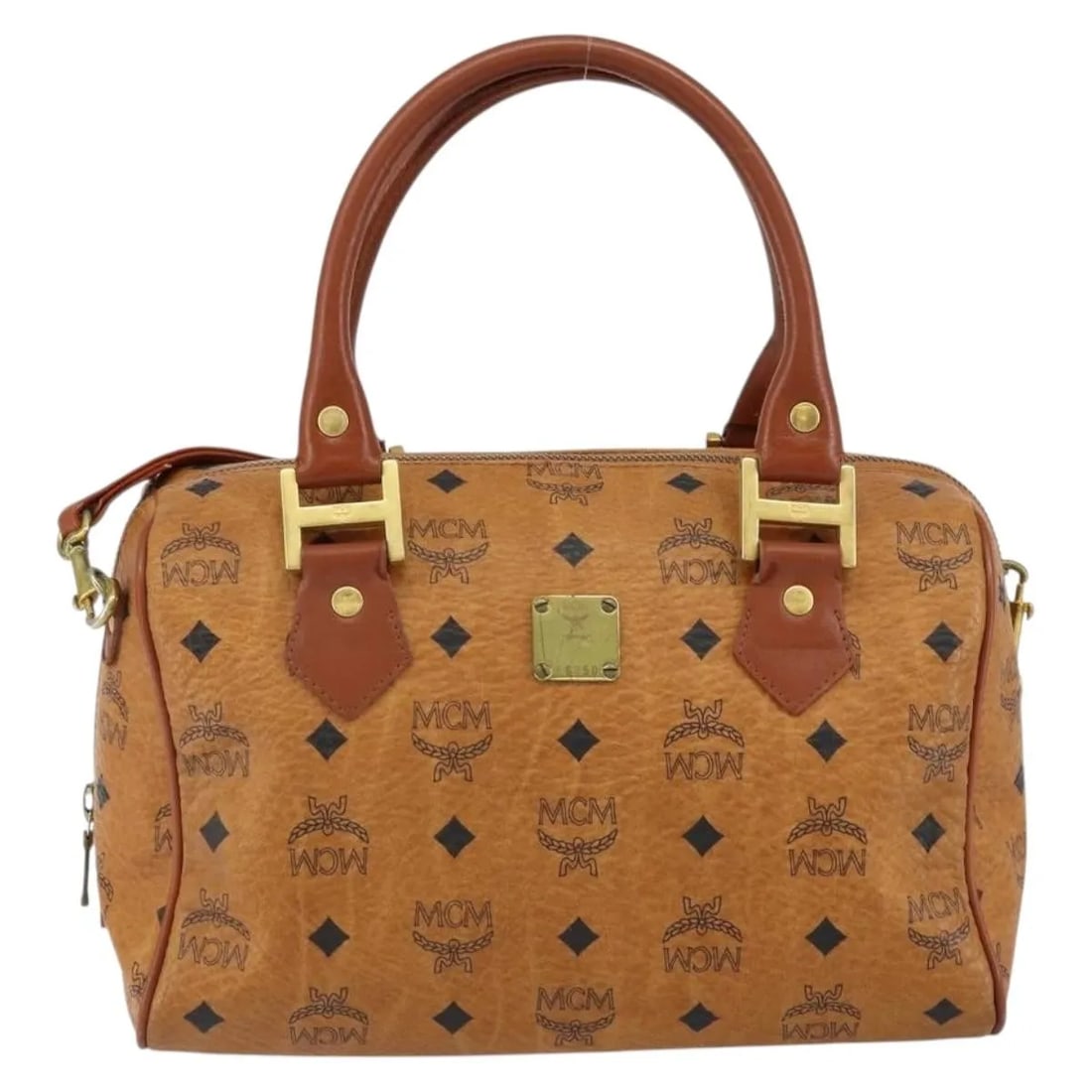 MCM Visetos Brown Canvas Handbag with Leather Trim: MCM Visetos Brown Canvas Handbag with Leather Trim This pre-owned MCM Visetos handbag features the brand's signature logogram on brown canvas with leather accents. Designed for women, it offers a styl