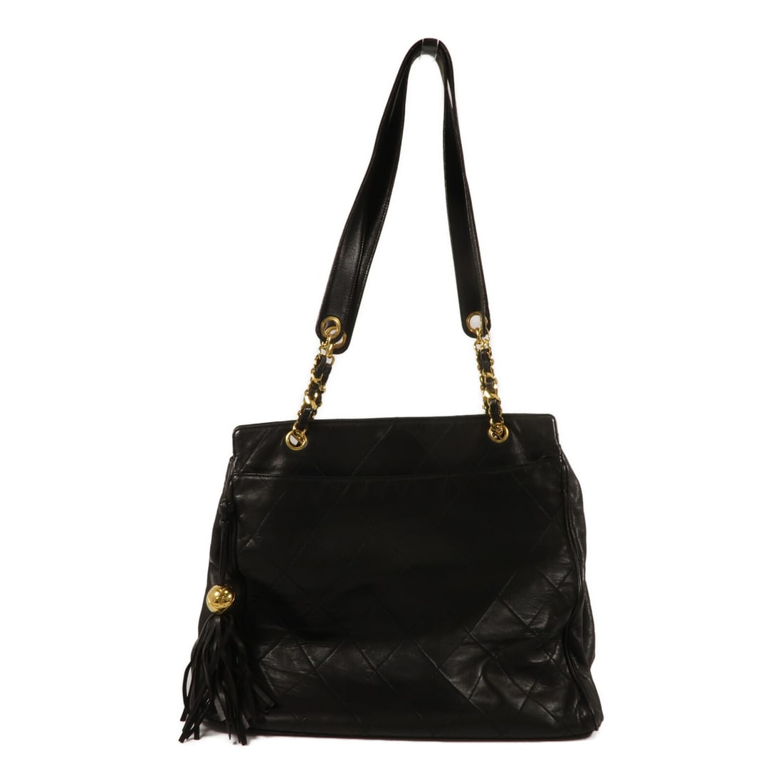 Black Lambskin CHANEL CC Tote Bag with GHW Vintage: Black Lambskin CHANEL CC Tote Bag with GHW Vintage Vintage CHANEL CC tote bag in black lambskin leather with gold-tone hardware. It features a magnetic pocket, two open exterior pockets, and two inter