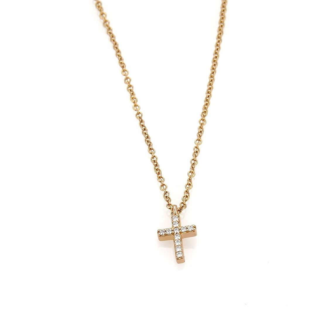 Tiffany & Co. Metro Cross Necklace 18k Rose Gold Diamond Pendant: Tiffany & Co. Metro Cross Necklace 18k Rose Gold Diamond Pendant This pre-owned Tiffany & Co. Metro Diamond Cross necklace is crafted in 18k rose gold and features a delicate cross pendant accented wi