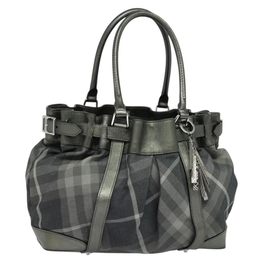 Canvas Black and Silver Tote with Dust Bag and Charm by Burberry: Canvas Black and Silver Tote with Dust Bag and Charm by Burberry This Burberry tote bag features a black and silver canvas exterior and is designed for women. The bag is equipped with dual handles and