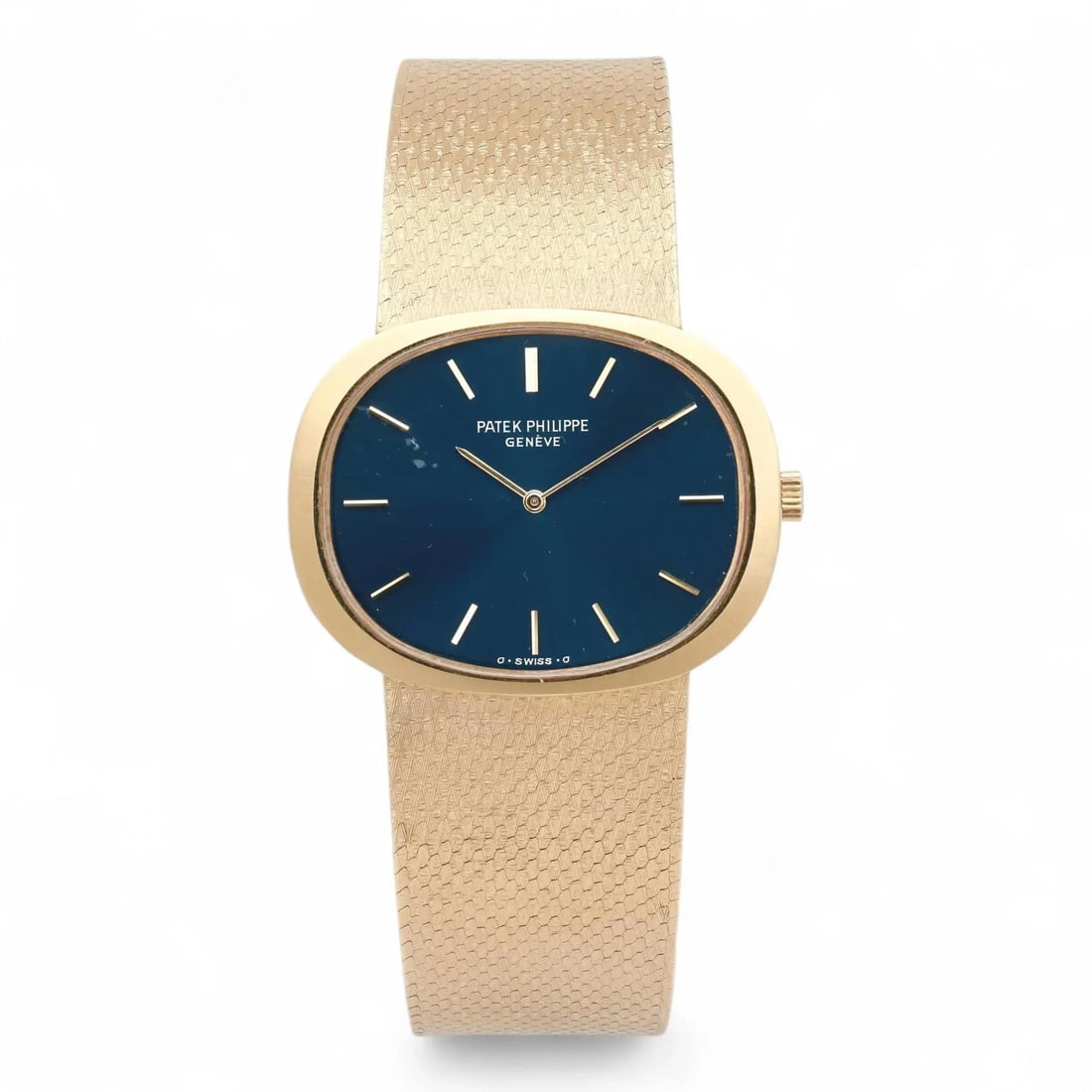 Ellipse Manual Swiss Watch in 18k Yellow Gold with Blue Dial by Patek Philippe: Ellipse Manual Swiss Watch in 18k Yellow Gold with Blue Dial by Patek Philippe This Patek Philippe Ellipse wristwatch features an 18k yellow gold case and band, complemented by a blue dial with stick 