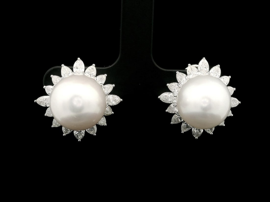 Platinum Clip On Earrings with 12.65mm Pearls and 3.20ctw Diamonds: Platinum Clip On Earrings with 12.65mm Pearls and 3.20ctw Diamonds Elevate your elegance with these stunning Platinum Clip-On Earrings featuring two perfectly round, natural cultured pearls measuring