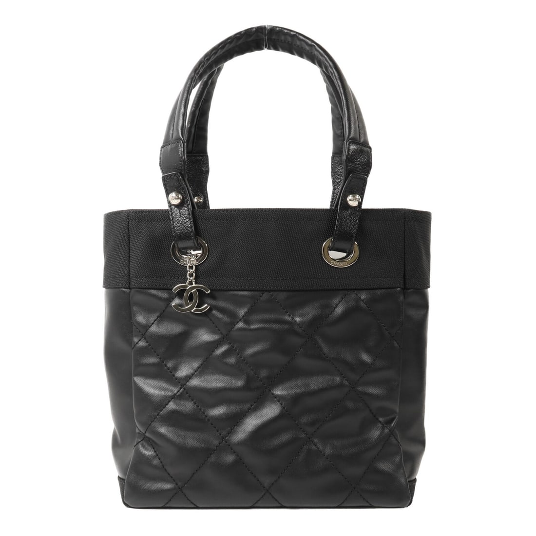 CHANEL Paris Biarritz A34208 Black Coated Canvas Nylon Handbag: CHANEL Paris Biarritz A34208 Black Coated Canvas Nylon Handbag A CHANEL Paris Biarritz handbag in black, made from PVC coated canvas and nylon. It features a fastener closure, one inside zip pocket, a