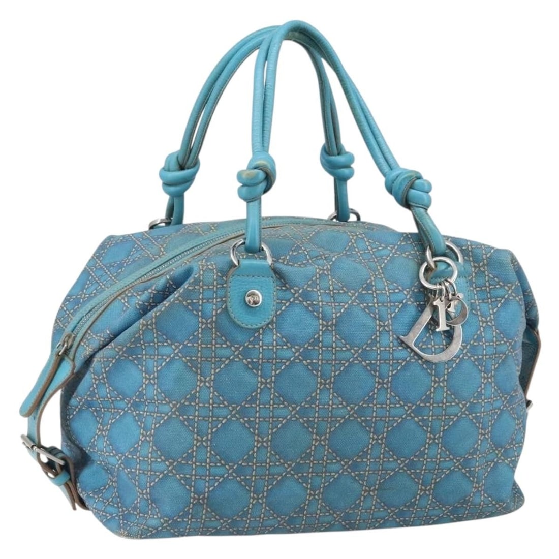 Panarea Boston Bag in Blue Coated Canvas by Christian Dior with Silver Accents: Panarea Boston Bag in Blue Coated Canvas by Christian Dior with Silver Accents This Christian Dior Panarea Boston Bag features a blue and silver coated canvas exterior with silver-tone details. The ba