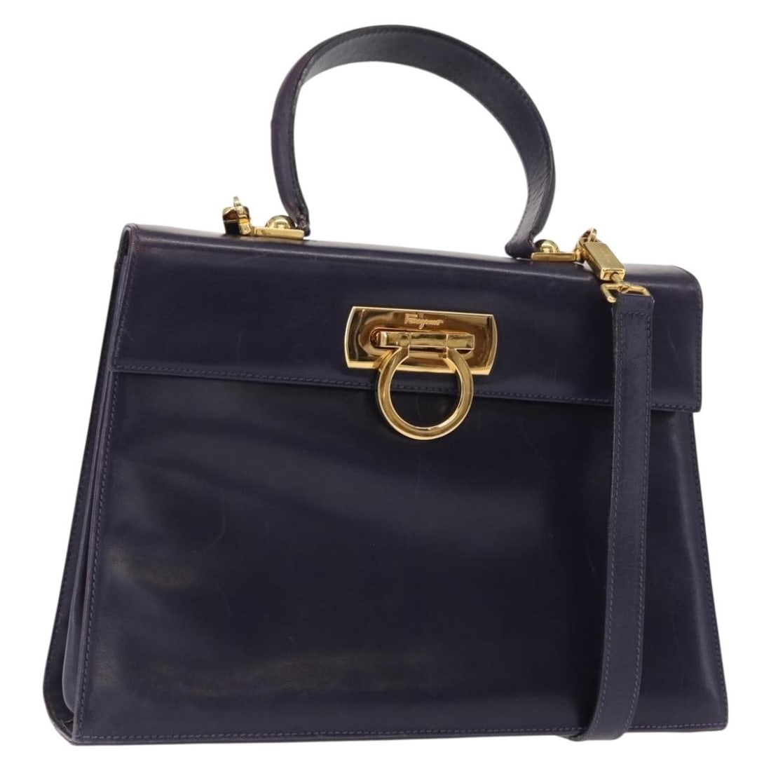 Salvatore Ferragamo Gancini Purple Leather 2way Tote with Shoulder Strap: Salvatore Ferragamo Gancini Purple Leather 2way Tote with Shoulder Strap Salvatore Ferragamo Gancini 2-way tote bag in purple leather with gold-tone accents. Made in Italy, this women's bag includes a