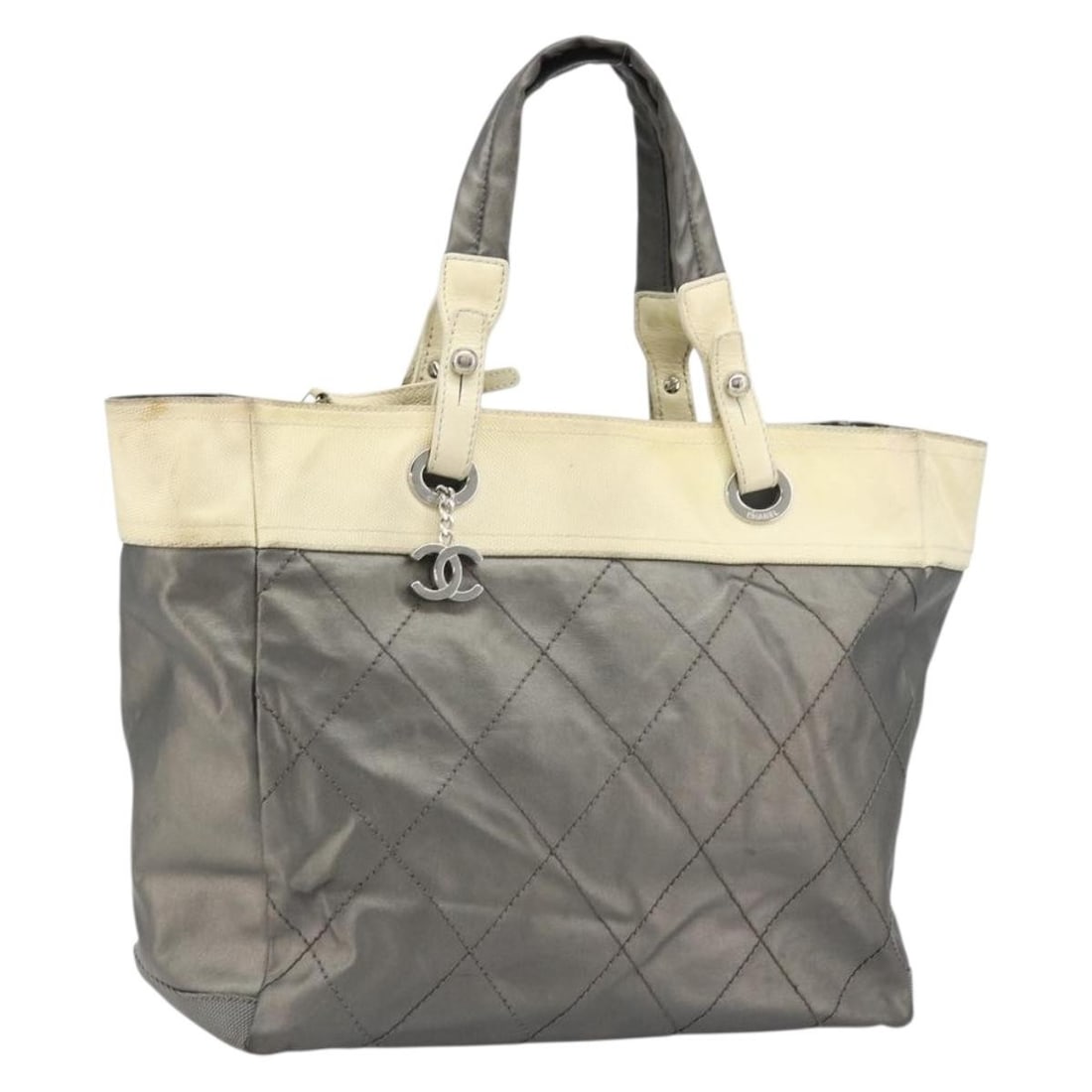 Chanel Paris Biarritz GM Gray Silver Coated Canvas Tote: Chanel Paris Biarritz GM Gray Silver Coated Canvas Tote A CHANEL Paris Biarritz GM tote bag in gray and silver coated canvas. Made in Italy, this bag features a tote style and comes with the item show