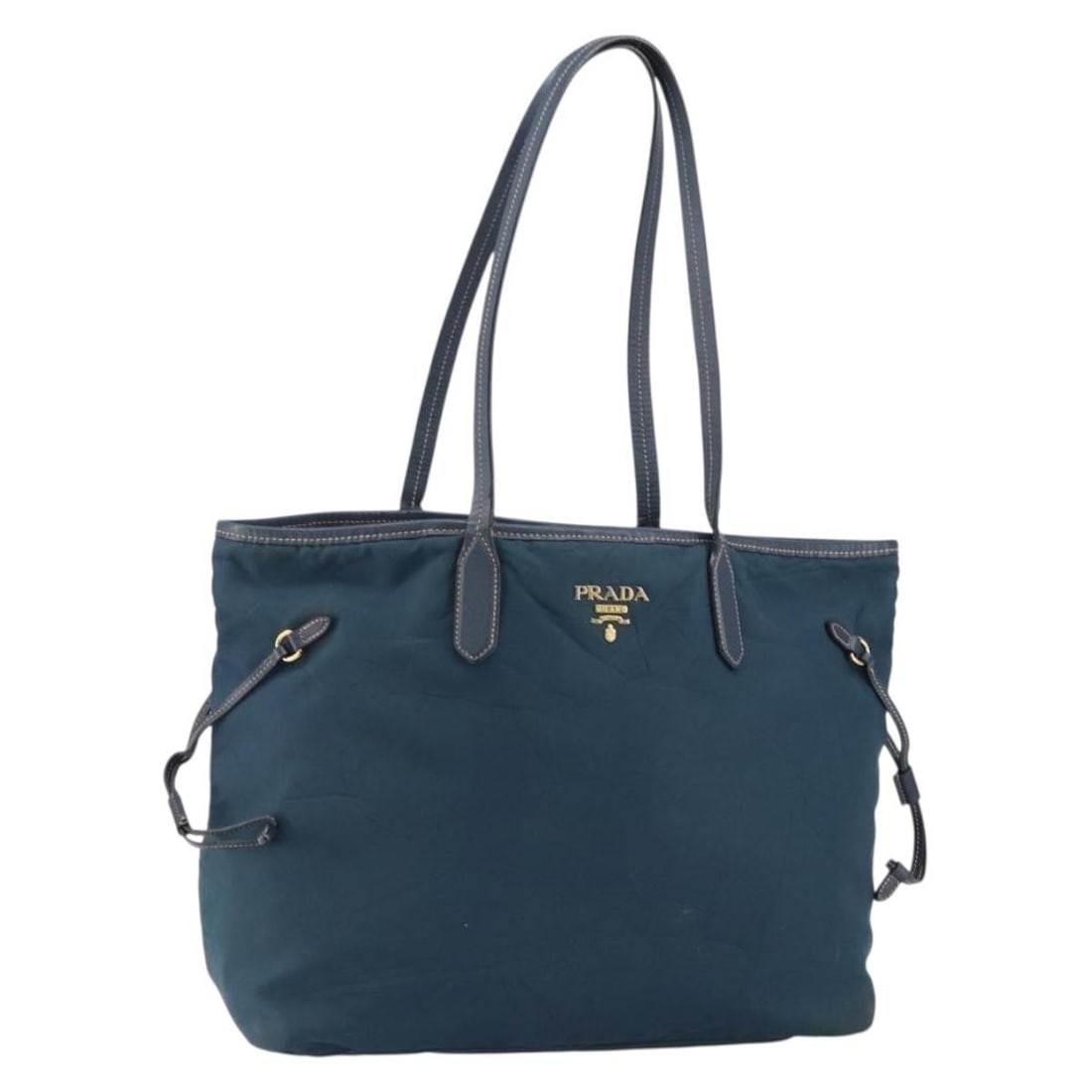 Prada Navy Nylon Tote with Gold Detail Made in Italy: Prada Navy Nylon Tote with Gold Detail Made in Italy This PRADA tote bag features a navy nylon exterior with gold-tone accents. Crafted in Italy, the bag offers a spacious interior and practical desig