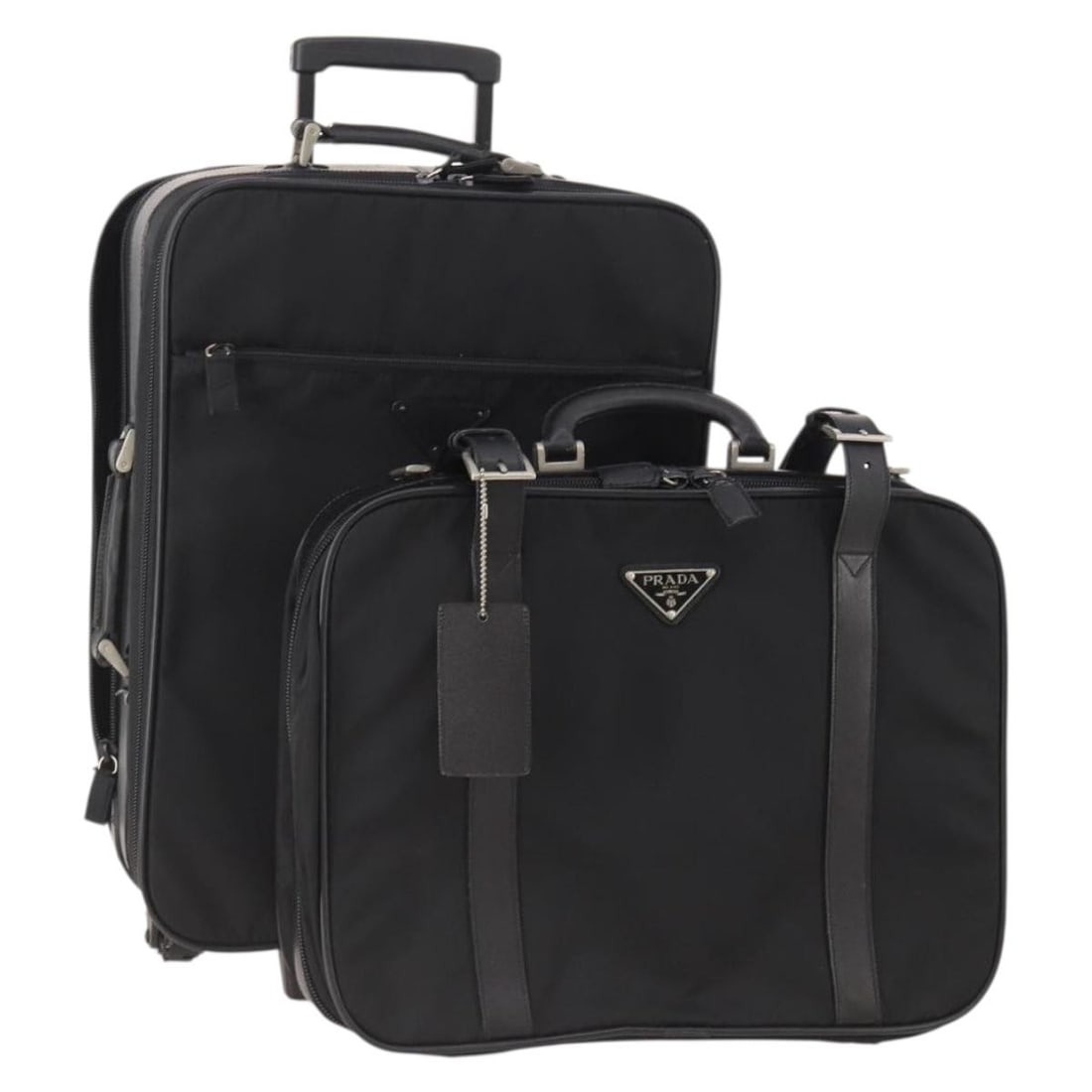 Set of 2 Prada black nylon trunks with name tag: Set of 2 Prada black nylon trunks with name tag Authentic Prada trunk set in black nylon for women, made in Italy. This special set sale includes a name tag accessory. Condition is heavily used, with 