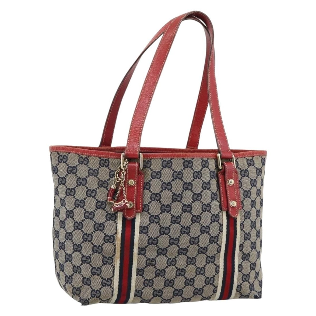 Gucci 137396 GG Canvas Tote with Charm Navy Gold: Gucci 137396 GG Canvas Tote with Charm Navy Gold Gucci tote bag in navy and gold GG canvas from the Sherry Line. This women's bag includes a charm and is made in Italy. Condition is heavily used, with