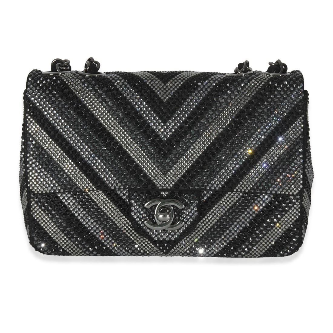 Chanel Black Strass Chevron Mini Flap Shoulder Bag: Chanel Black Strass Chevron Mini Flap Shoulder Bag This Chanel Black Strass CC Chevron Mini Flap Bag features an embellished exterior in a striking chevron pattern with the signature CC logo. Crafted 