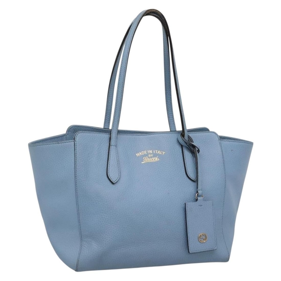 Gucci 354408 Light Blue Leather Tote Bag with Name Tag: Gucci 354408 Light Blue Leather Tote Bag with Name Tag A Gucci tote bag in light blue leather, made in Italy. It comes with a name tag accessory and features a structured tote style with handle drop o
