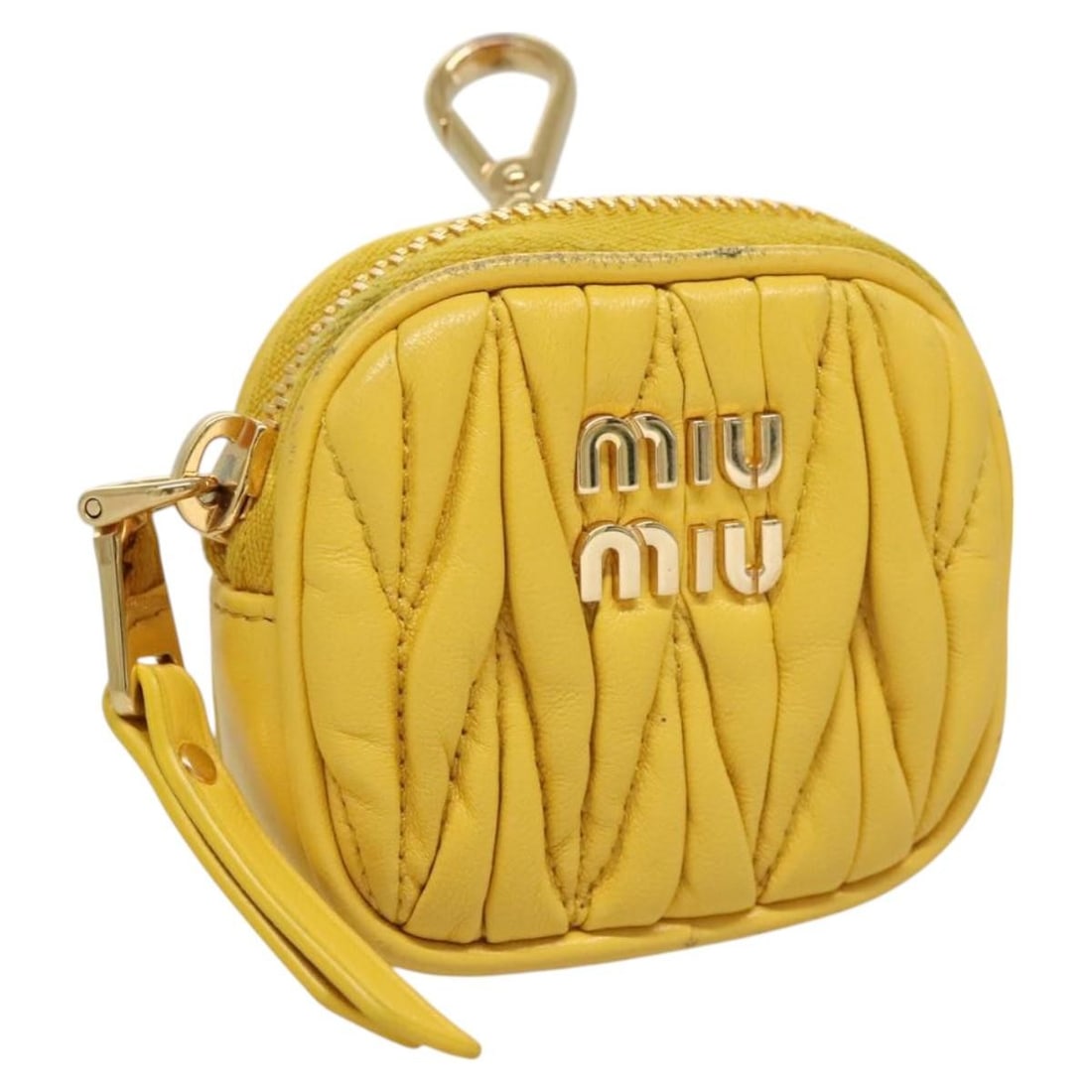 Miu Miu Yellow Gold Lambskin Matelasse Earphone Case for AirPods: Miu Miu Yellow Gold Lambskin Matelasse Earphone Case for AirPods This Miu Miu Matelasse earphone case is crafted from lamb skin in a yellow and gold color scheme. Designed for women, the case is made 