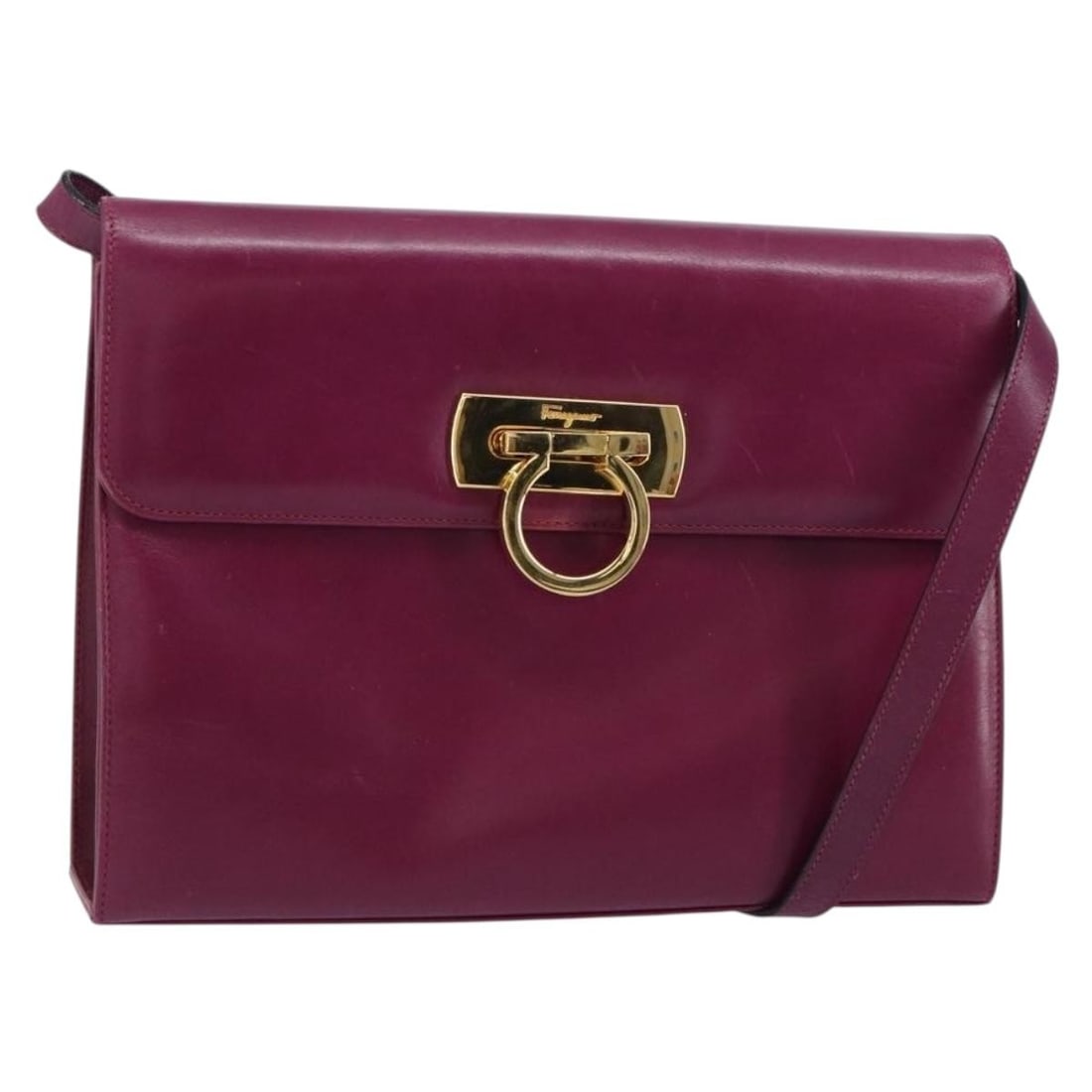 Purple Leather Gancini Shoulder Bag by Salvatore Ferragamo Gold Accents Italy: Purple Leather Gancini Shoulder Bag by Salvatore Ferragamo Gold Accents Italy This Salvatore Ferragamo Gancini shoulder bag features a purple and gold leather exterior with gold-tone hardware. Crafted