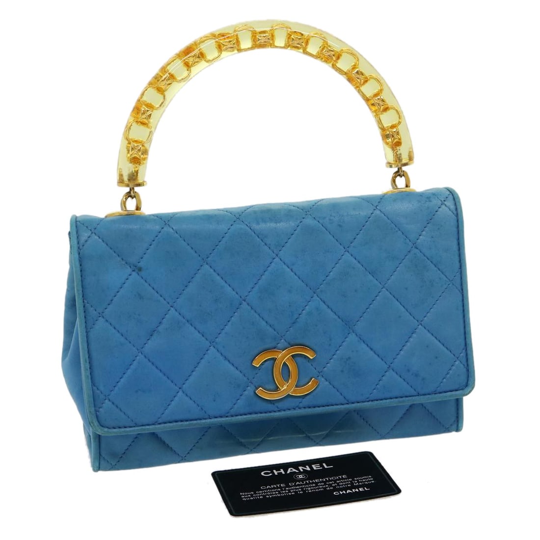 CHANEL CC Blue Lambskin Hand Bag with Guarantee Card: CHANEL CC Blue Lambskin Hand Bag with Guarantee Card CHANEL hand bag in blue leather/lamb skin, made in Italy. The bag comes with a guarantee card and features a compact size with approximate dimensio